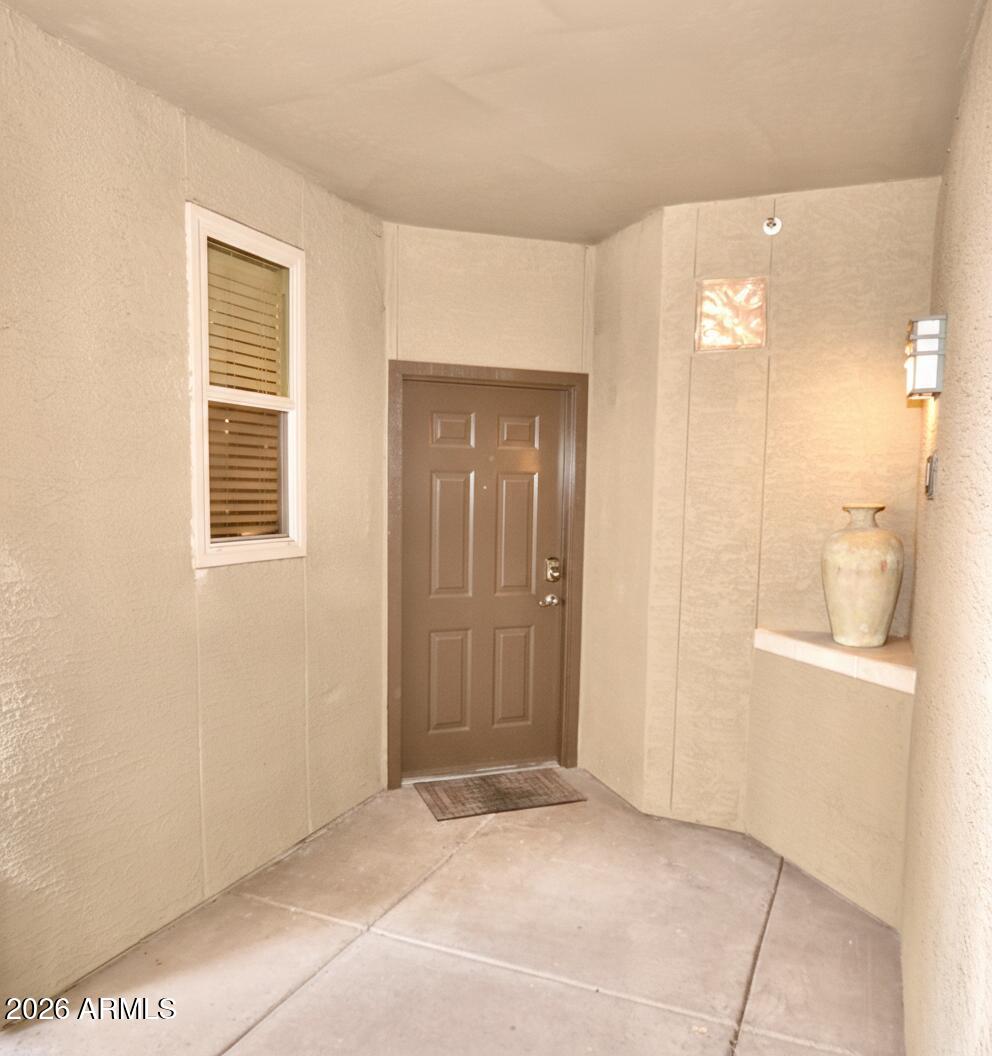 5303 North 7th Street, Unit 117 Phoenix, AZ 85014 - Photo 22 of 31 a view of an empty room with an entryway