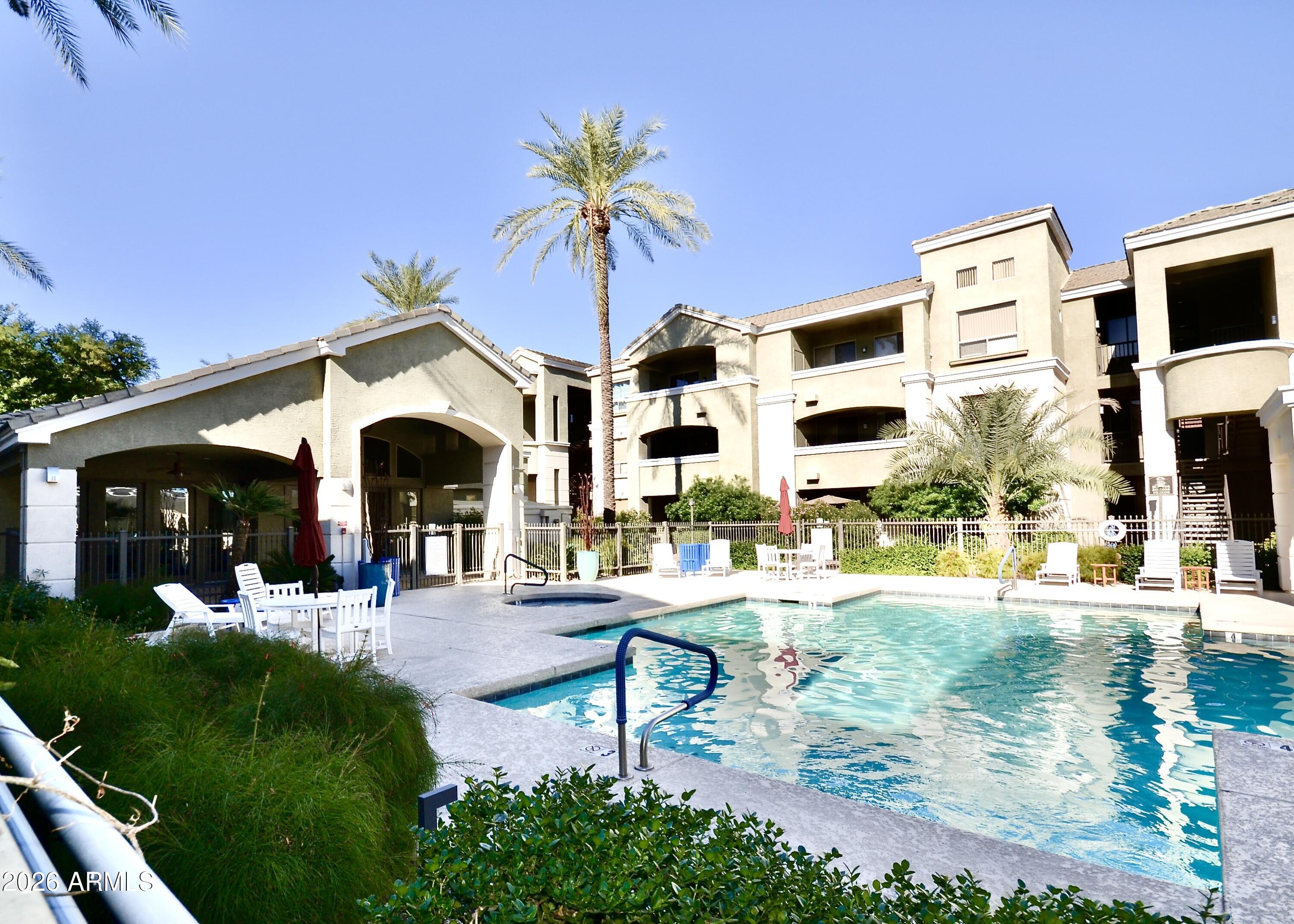 5303 North 7th Street, Unit 117 Phoenix, AZ 85014 - Photo 25 of 31 a view of a house with backyard and sitting area
