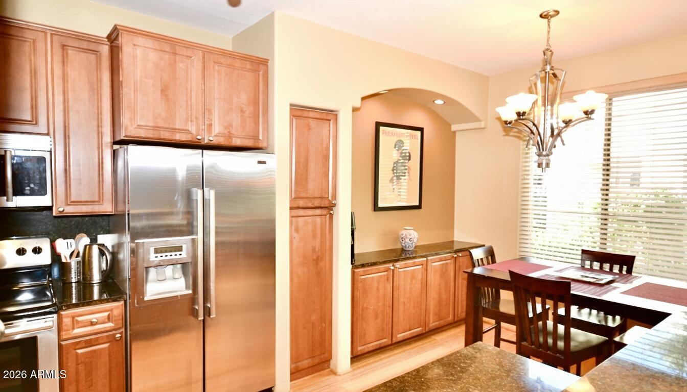 5303 North 7th Street, Unit 117 Phoenix, AZ 85014 - Photo 9 of 31 a view of kitchen with furniture and chandelier