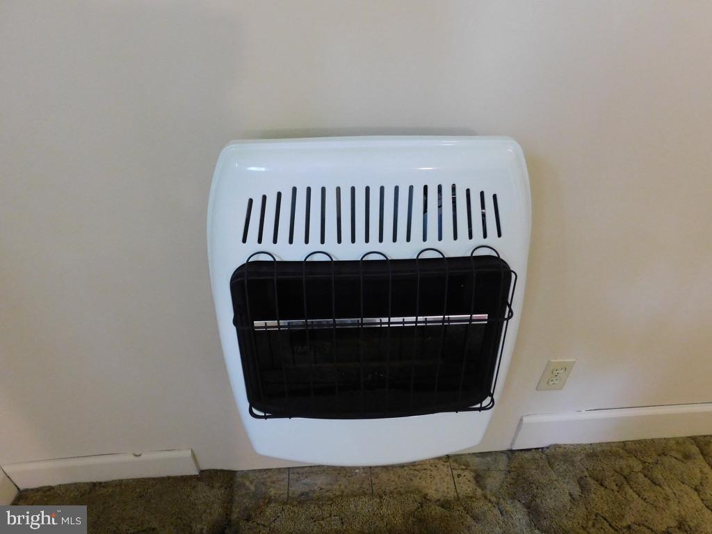 4720 Mawani Road Baltimore, MD 21206 - Photo 23 of 34 Cozy gas heat in Master Bedroom