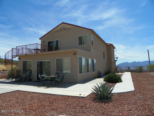 1809 Círculo Tortuga Rio Rico, AZ 85648 - Photo 4 of 26 a front view of a house with a yard