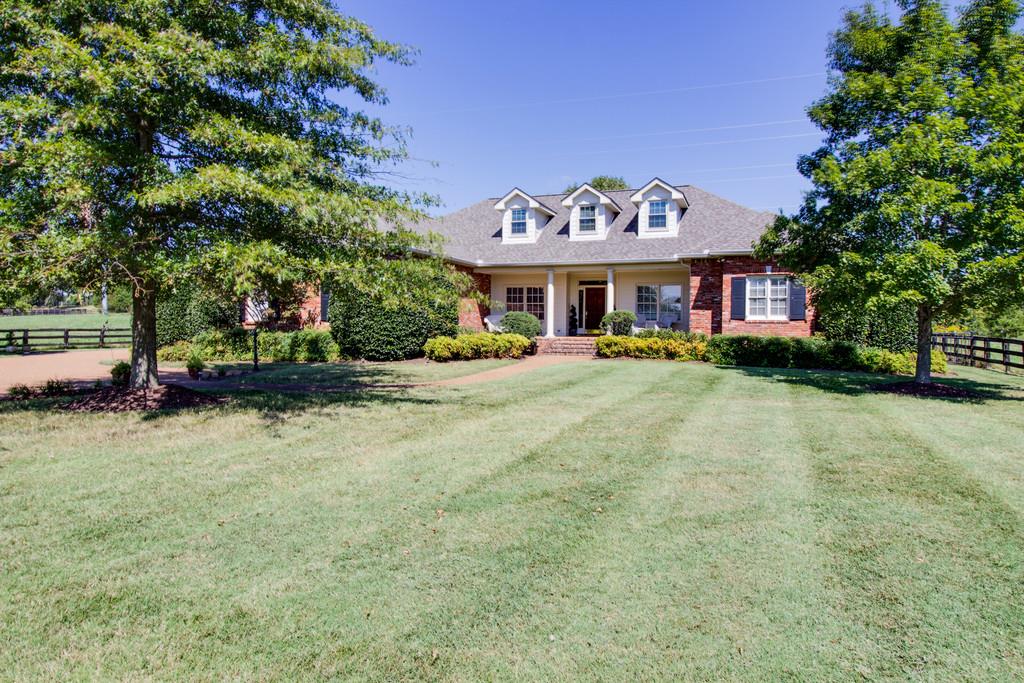 4670 Murfreesboro Road Franklin, TN 37067 - Photo 1 of 30 a front view of a house with a yard