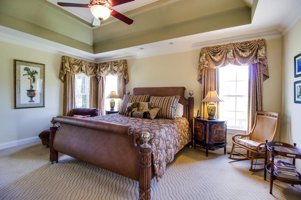 4670 Murfreesboro Road Franklin, TN 37067 - Photo 12 of 30 a bed room with a bed and a chandelier