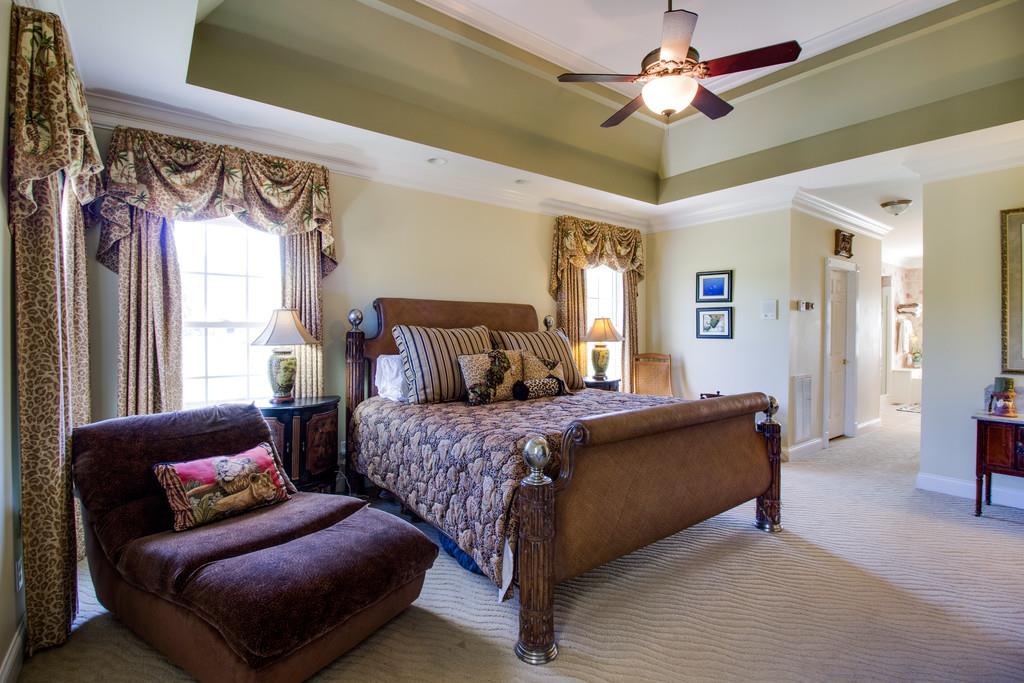 4670 Murfreesboro Road Franklin, TN 37067 - Photo 13 of 30 a bedroom with furniture and a chandelier
