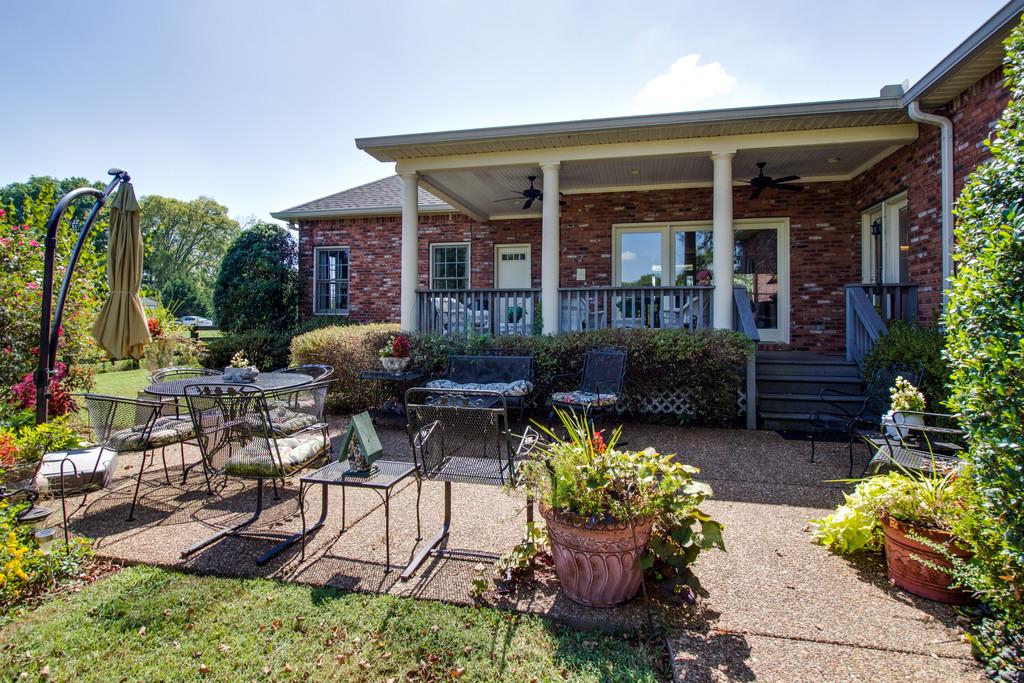 4670 Murfreesboro Road Franklin, TN 37067 - Photo 28 of 30 a view of a house with patio furniture and garden