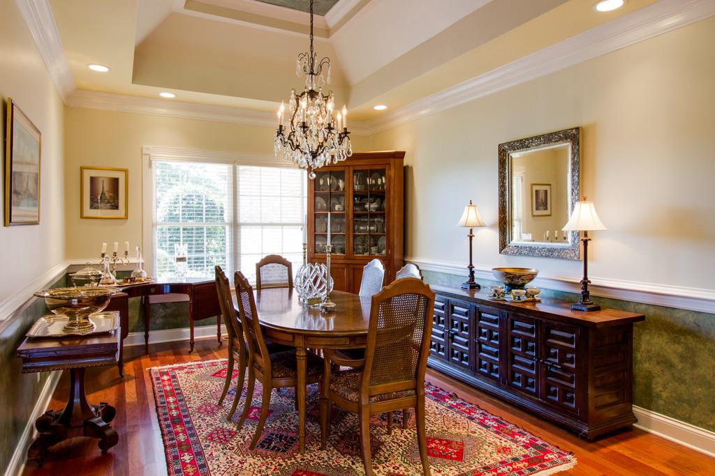 4670 Murfreesboro Road Franklin, TN 37067 - Photo 10 of 30 a dining room with furniture a chandelier and wooden floor