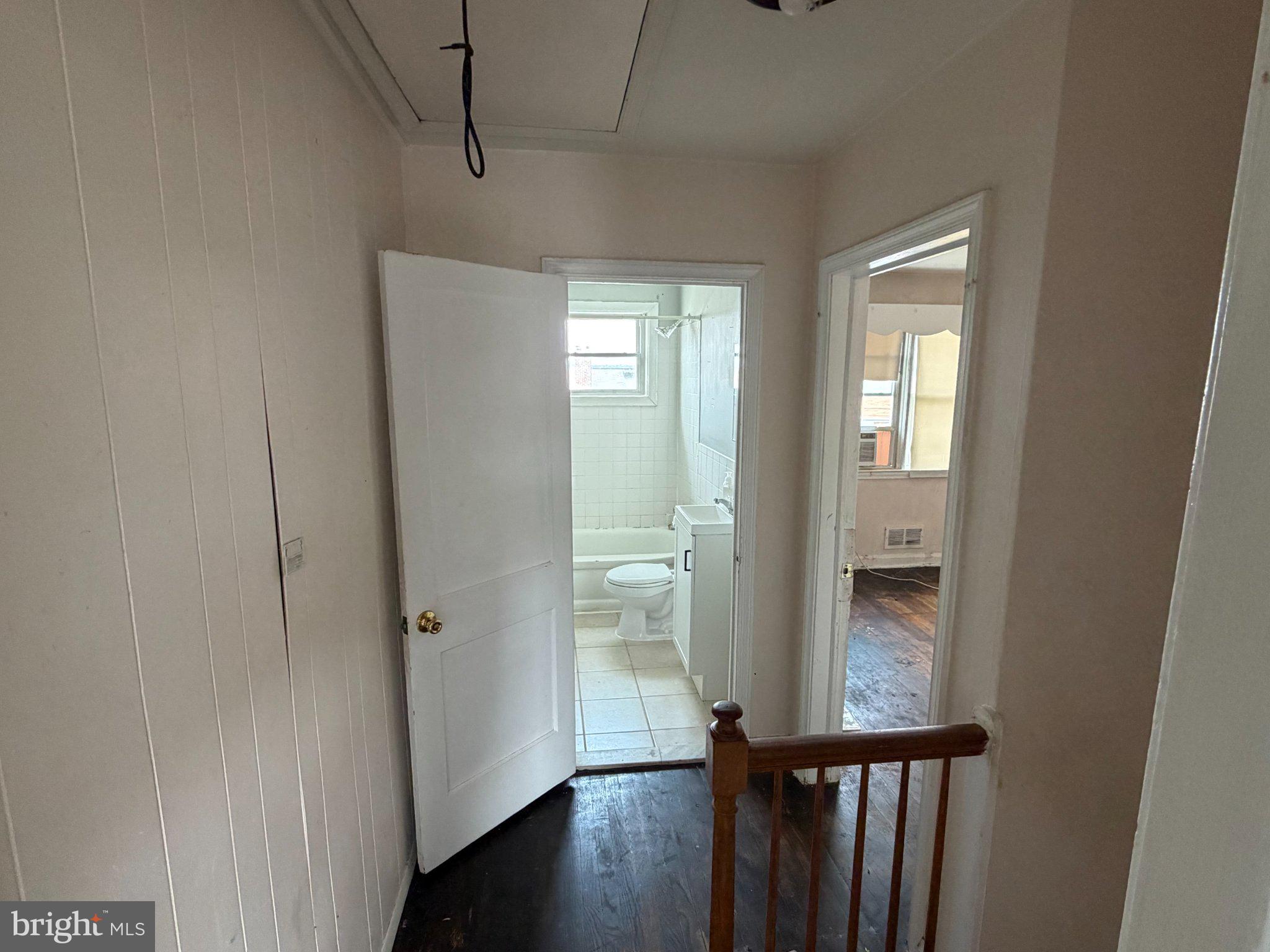 7216 Conley Street Baltimore, MD 21224 - Photo 9 of 14 Bright and inviting hallway entrance.
