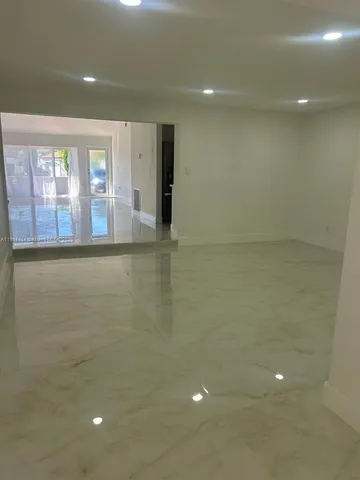 a view of house with backyard