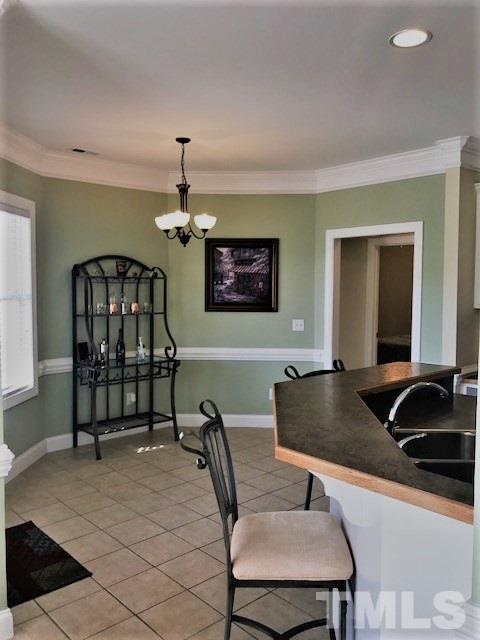 11539 Rockside Road Middlesex, NC 27557 - Photo 7 of 25 a dining room with furniture and chandelier