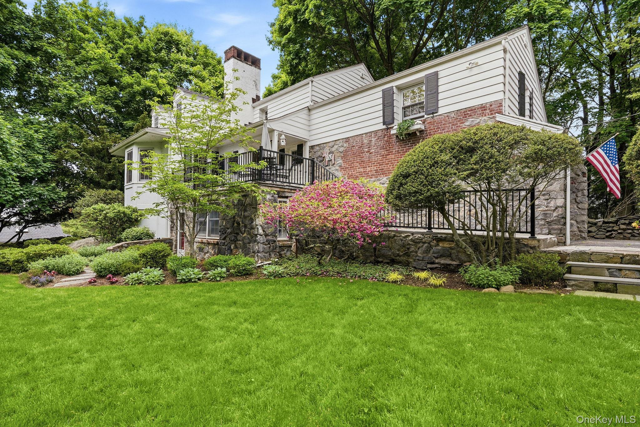 26 Cedarlawn Road Irvington, NY 10533 - Photo 3 of 34 a view of a house with a garden