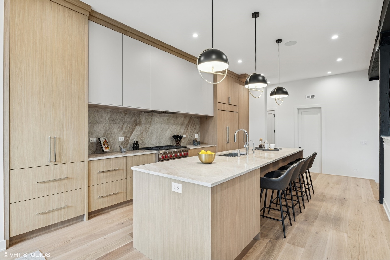 401 North Aberdeen Street, Unit 2N Chicago, IL 60642 - Photo 11 of 37 a kitchen with a sink a center island stainless steel appliances and cabinets