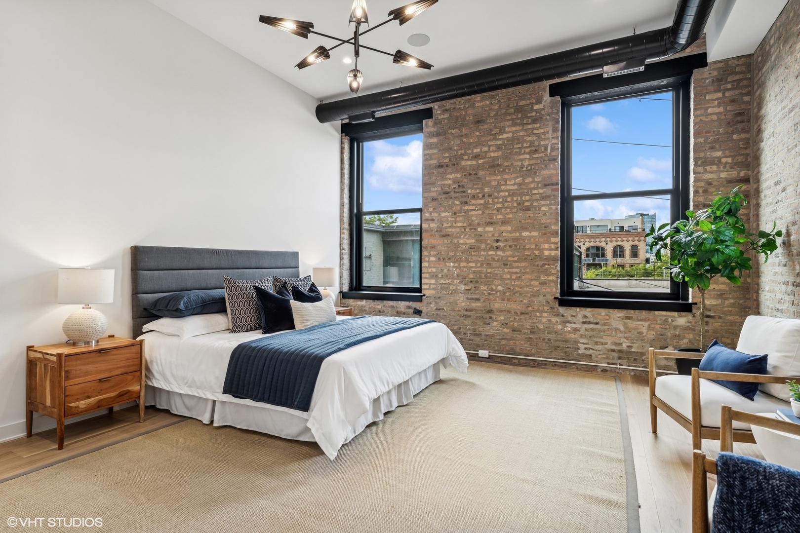 401 North Aberdeen Street, Unit 2N Chicago, IL 60642 - Photo 23 of 37 a bedroom with a bed dresser and a window