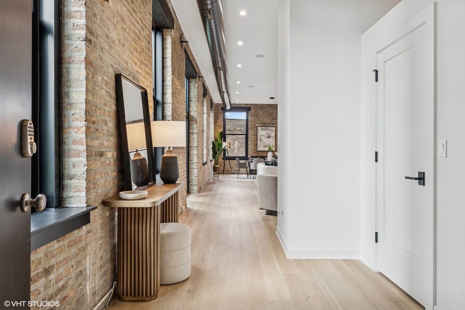 401 North Aberdeen Street, Unit 2N Chicago, IL 60642 - Photo 3 of 37 a view of an entryway with wooden floor