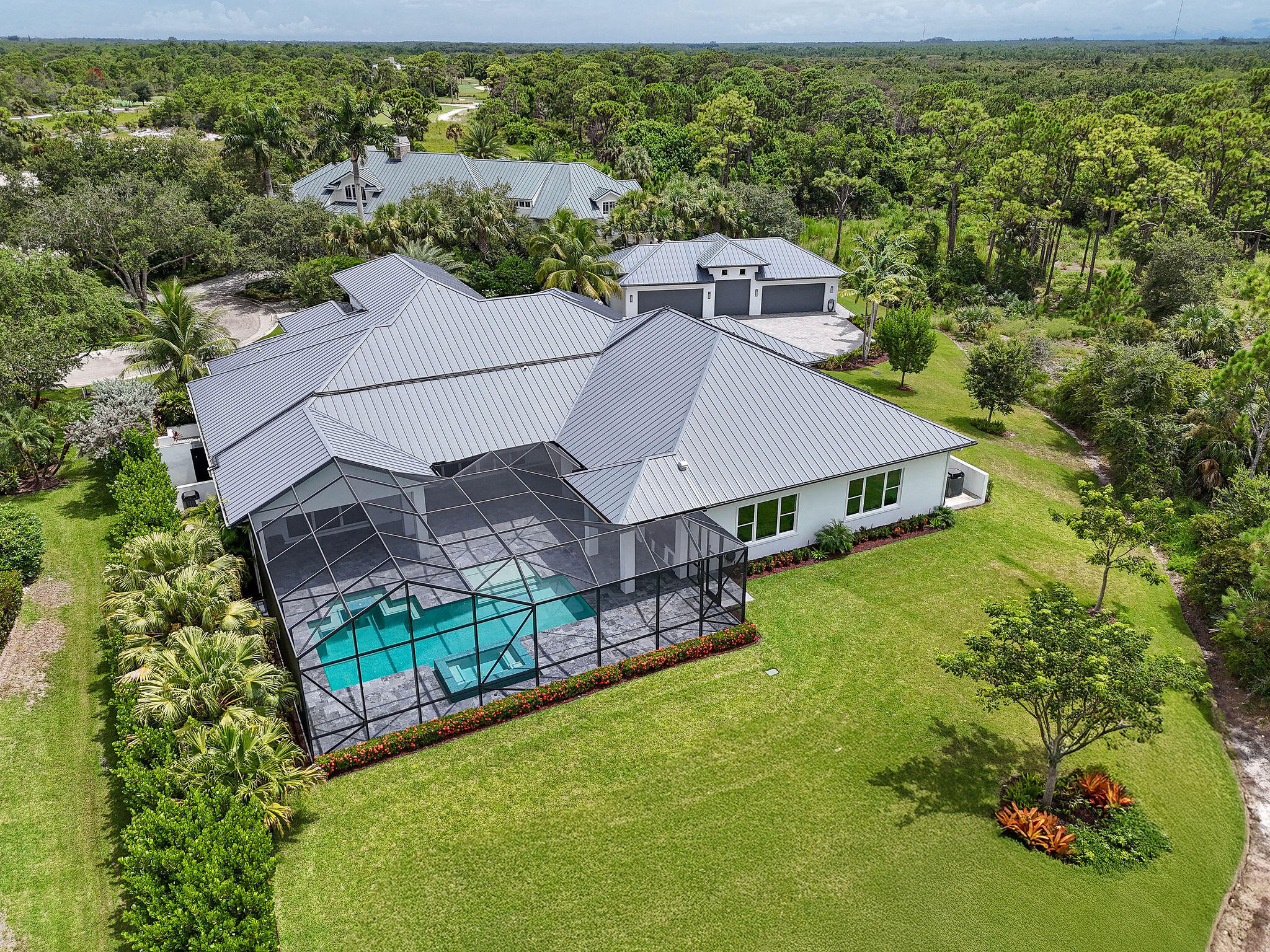 6219 Southeast Moss Ridge Pointe Hobe Sound, FL 33455 - Photo 107 of 108 an aerial view of a house with a yard