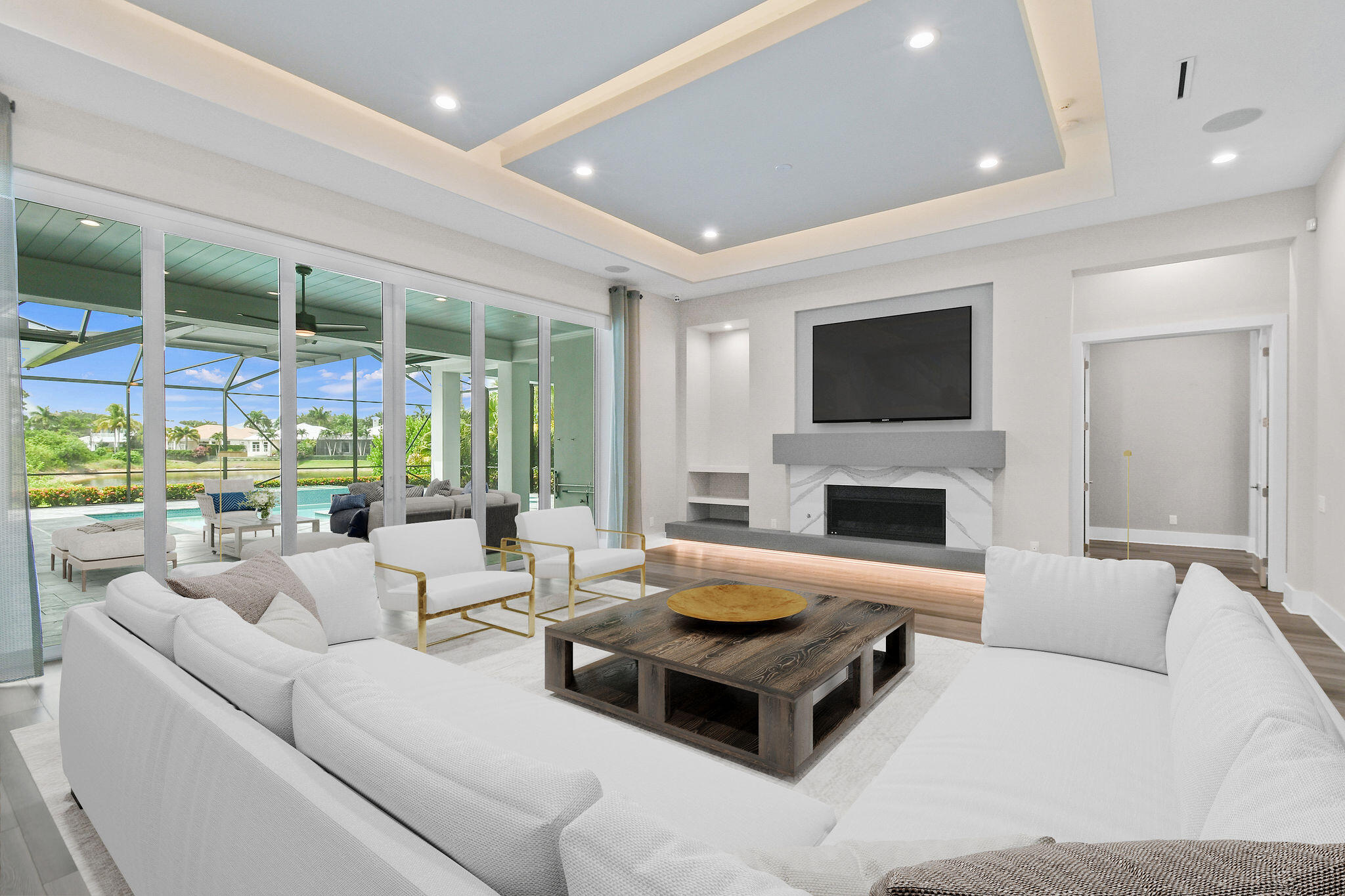 6219 Southeast Moss Ridge Pointe Hobe Sound, FL 33455 - Photo 12 of 108 a living room with furniture fireplace and a flat screen tv