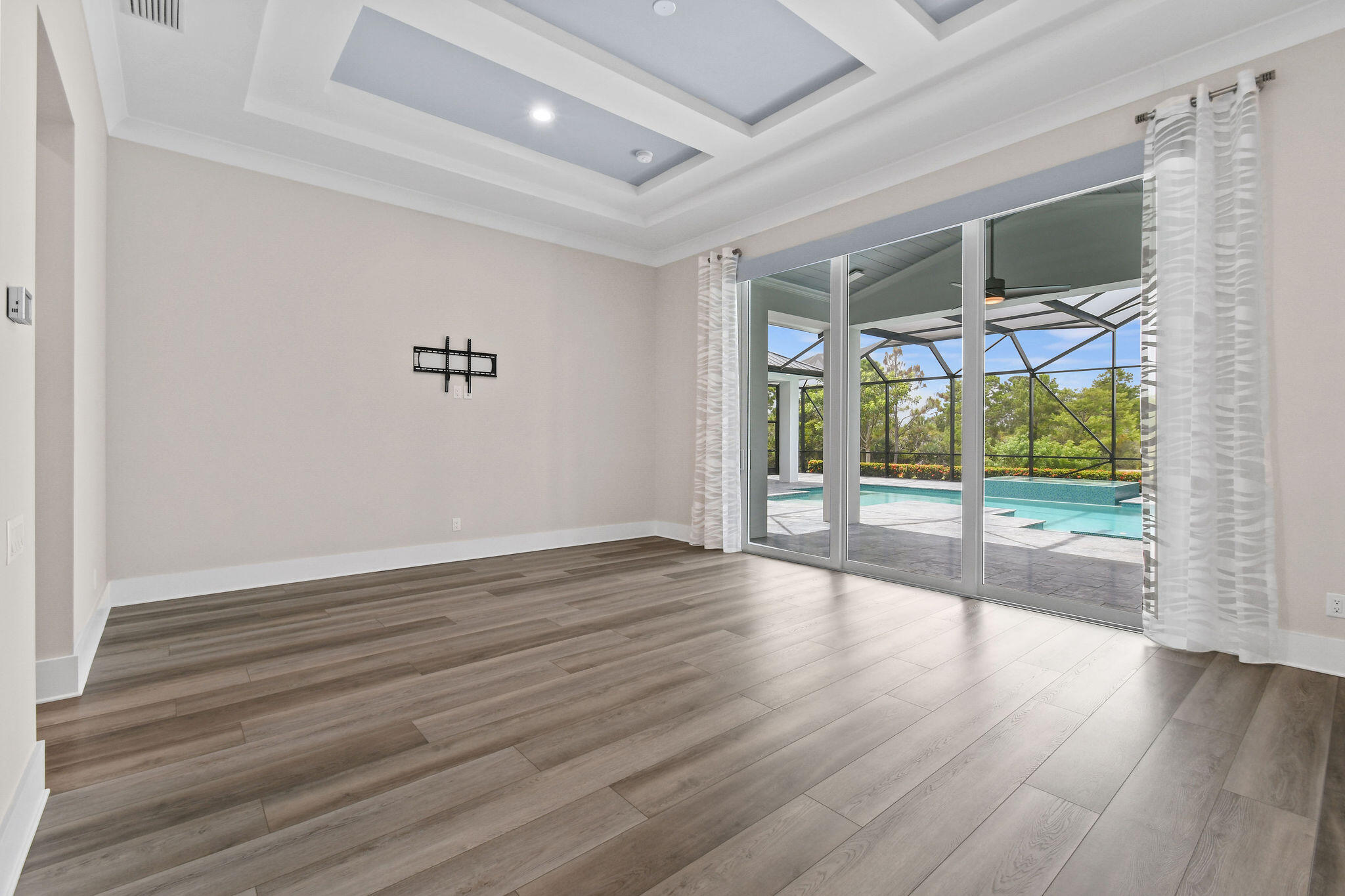 6219 Southeast Moss Ridge Pointe Hobe Sound, FL 33455 - Photo 26 of 108 a view of empty room with wooden floor and fan