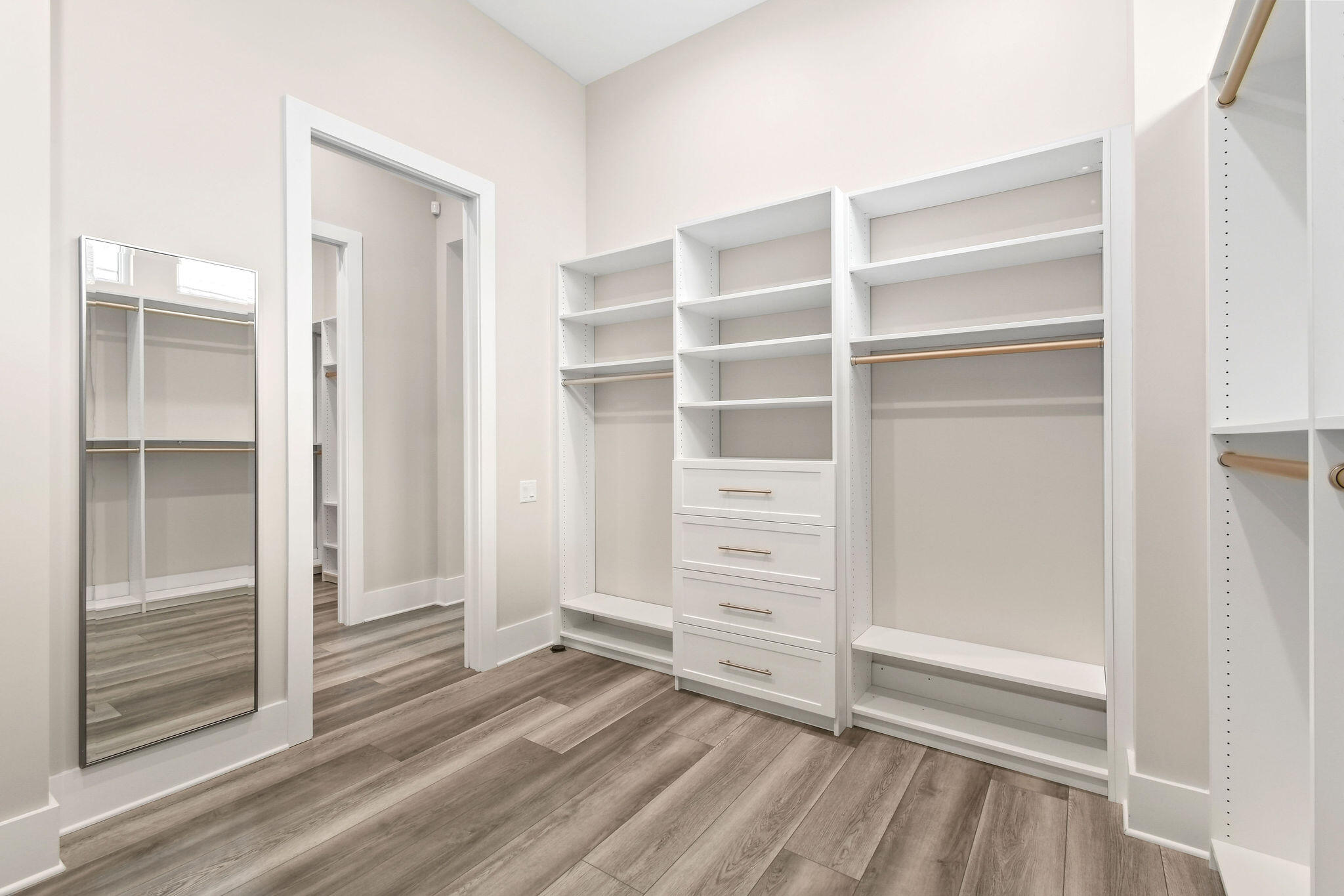 6219 Southeast Moss Ridge Pointe Hobe Sound, FL 33455 - Photo 31 of 108 a view of walk in closet with empty racks