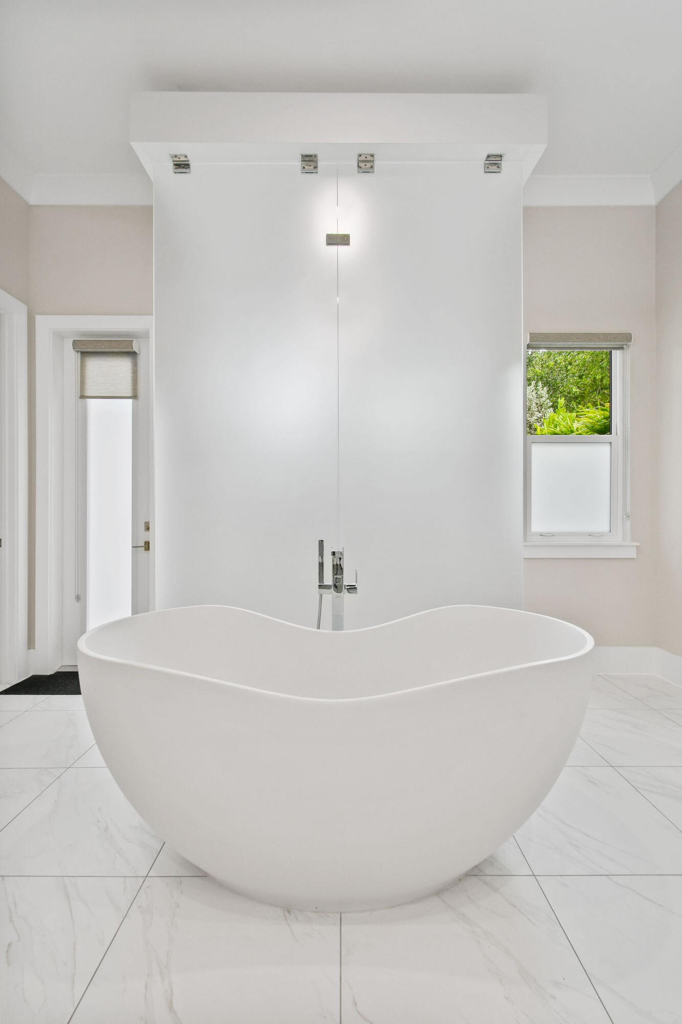 6219 Southeast Moss Ridge Pointe Hobe Sound, FL 33455 - Photo 34 of 108 a white bath tub sitting in a bathroom