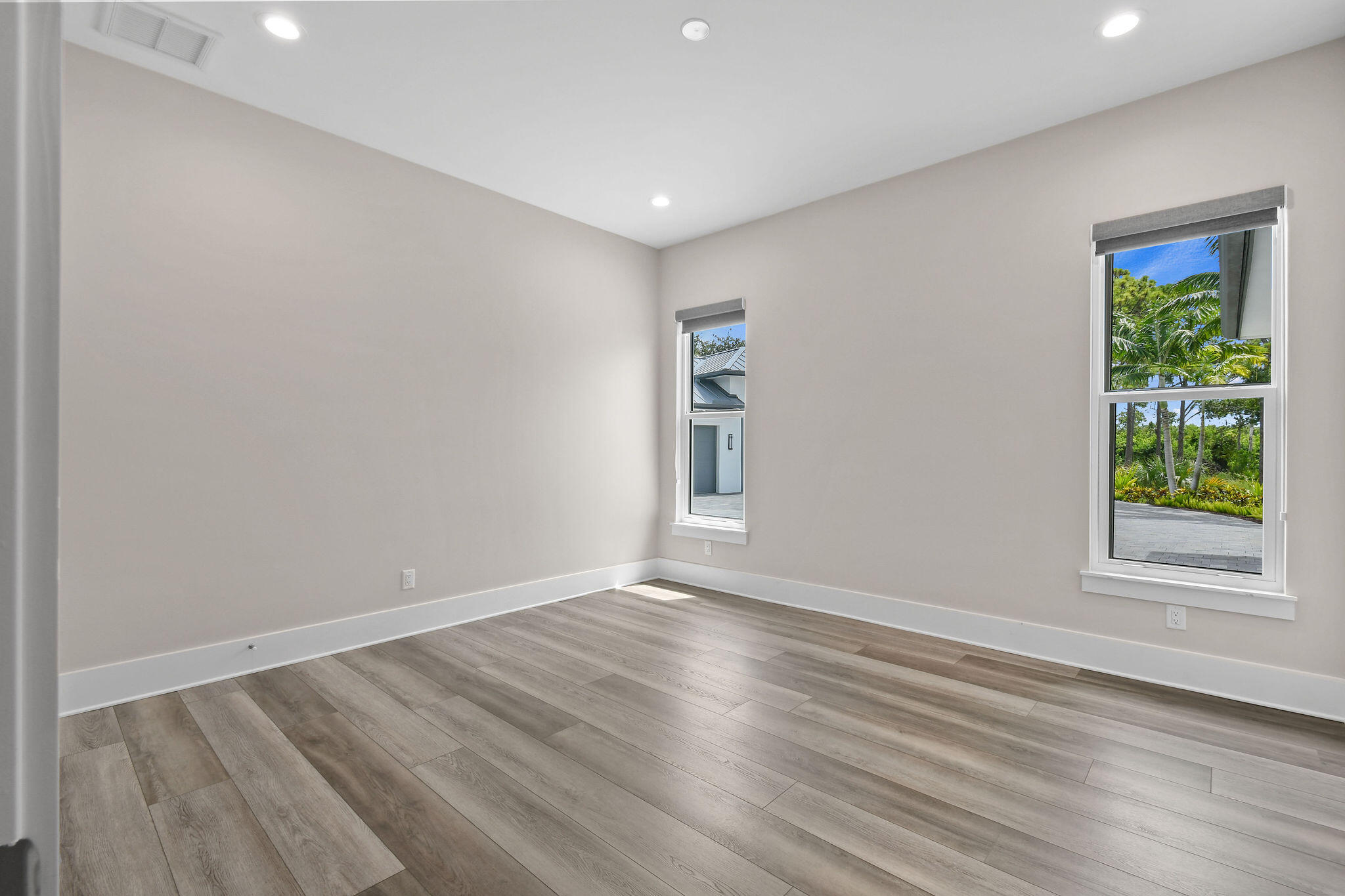 6219 Southeast Moss Ridge Pointe Hobe Sound, FL 33455 - Photo 48 of 108 a view of an empty room with wooden floor and a window
