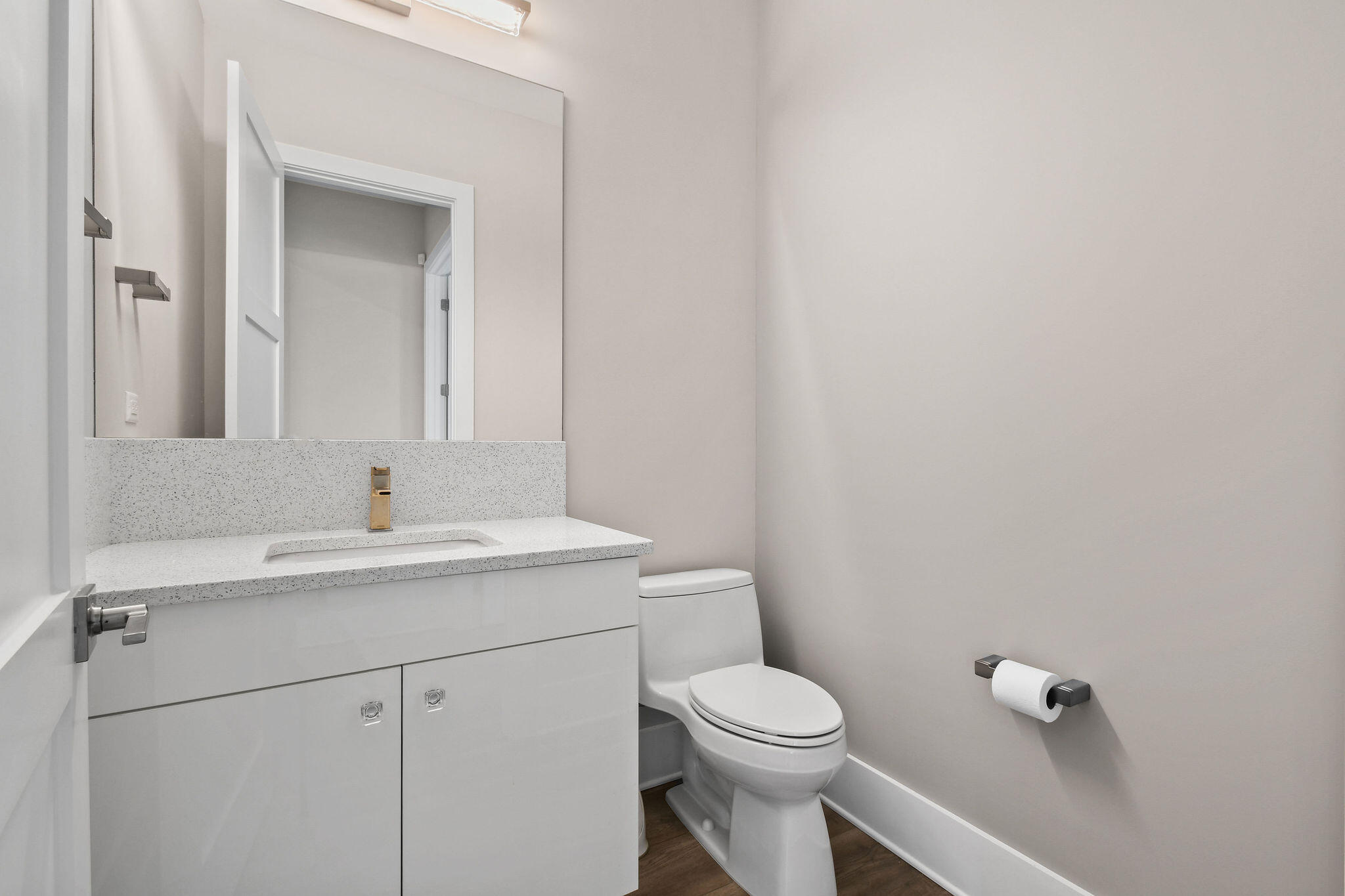 6219 Southeast Moss Ridge Pointe Hobe Sound, FL 33455 - Photo 56 of 108 a bathroom with a toilet a sink and mirror