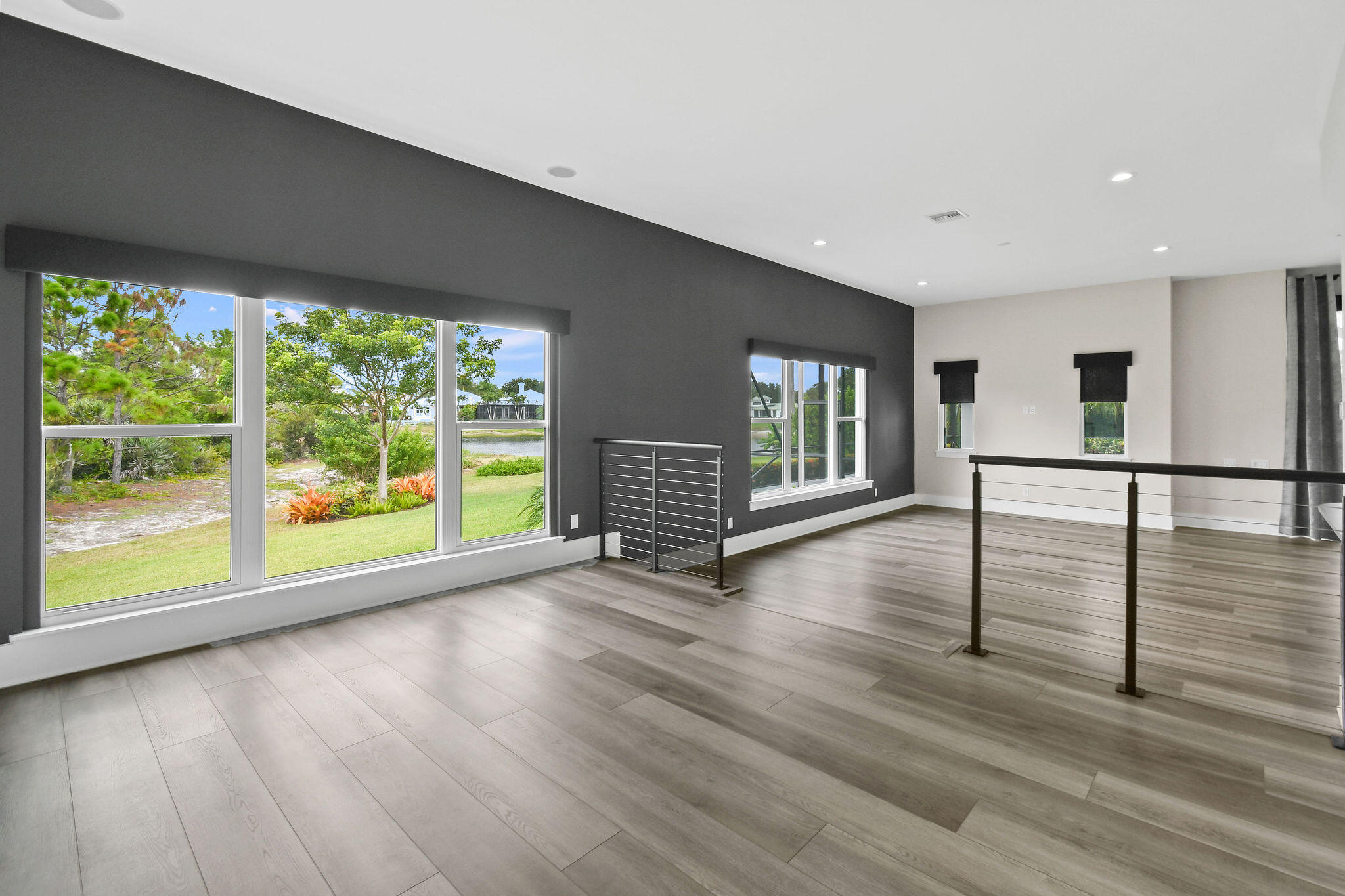 6219 Southeast Moss Ridge Pointe Hobe Sound, FL 33455 - Photo 64 of 108 a view of an empty room with wooden floor and a window