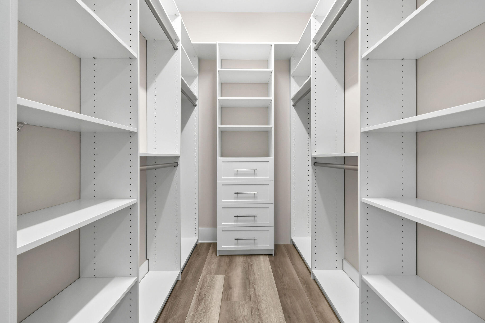 6219 Southeast Moss Ridge Pointe Hobe Sound, FL 33455 - Photo 75 of 108 a view of walk in closet with empty racks