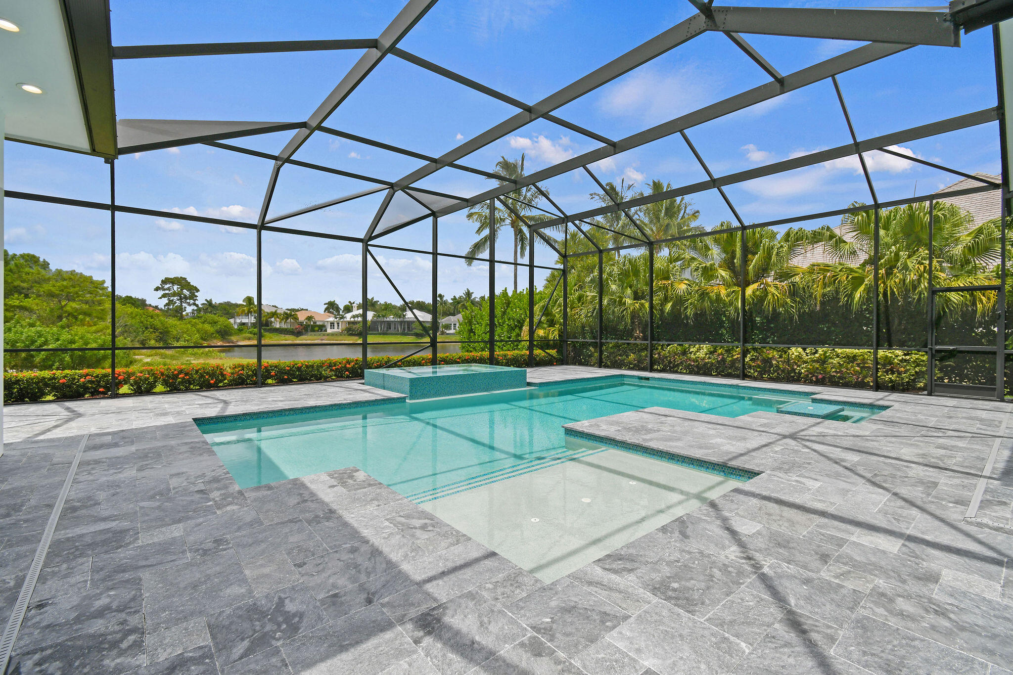 6219 Southeast Moss Ridge Pointe Hobe Sound, FL 33455 - Photo 82 of 108 a view of a backyard with lawn chairs and plants