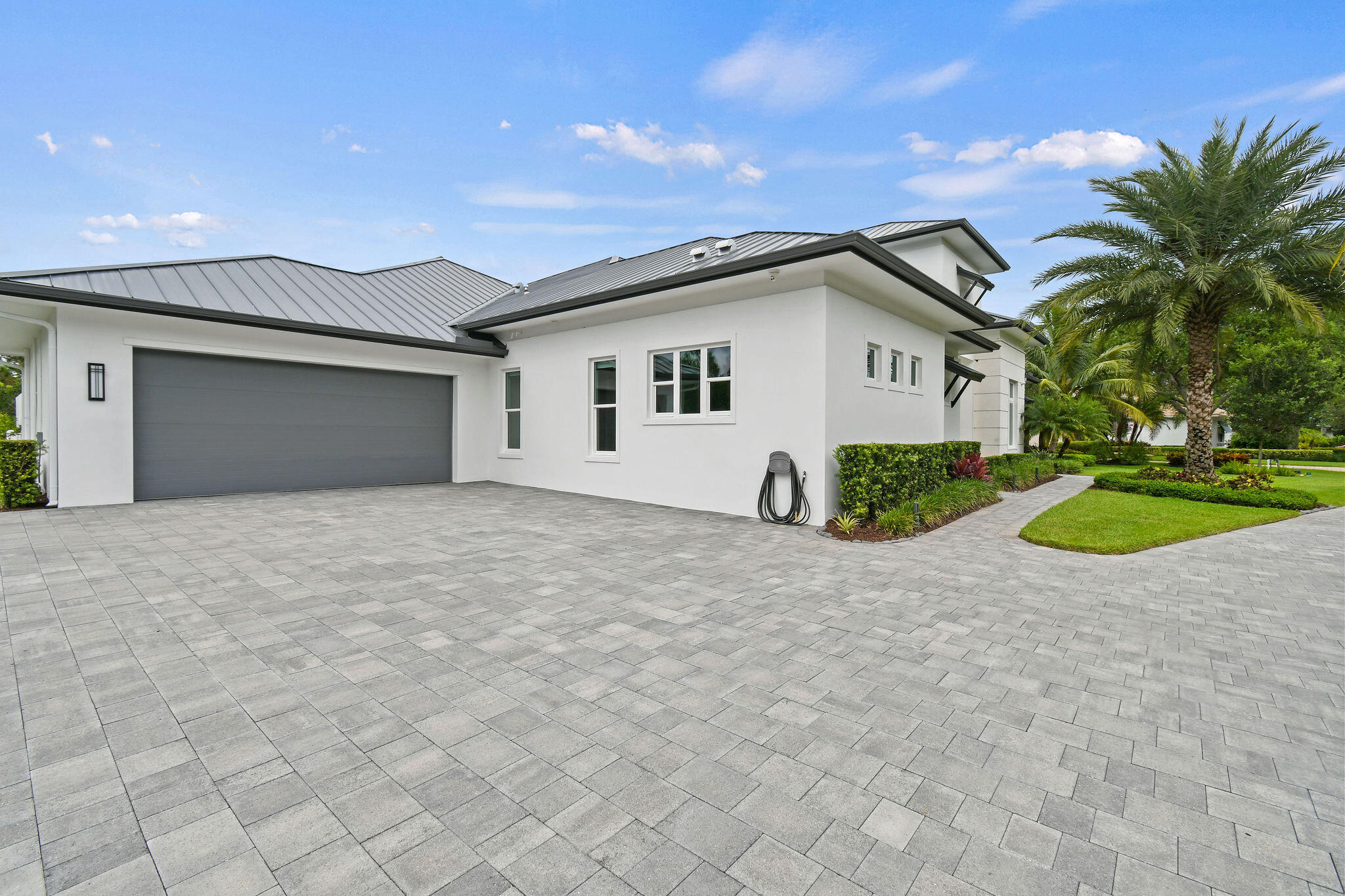 6219 Southeast Moss Ridge Pointe Hobe Sound, FL 33455 - Photo 88 of 108 a view of a house with a yard and potted plants