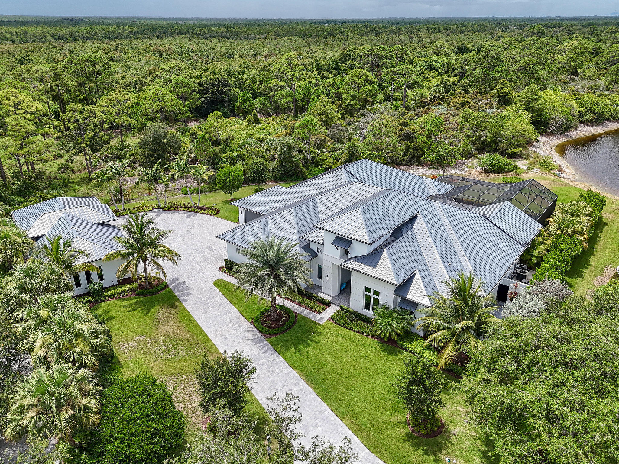 6219 Southeast Moss Ridge Pointe Hobe Sound, FL 33455 - Photo 93 of 108 an aerial view of a house with a garden