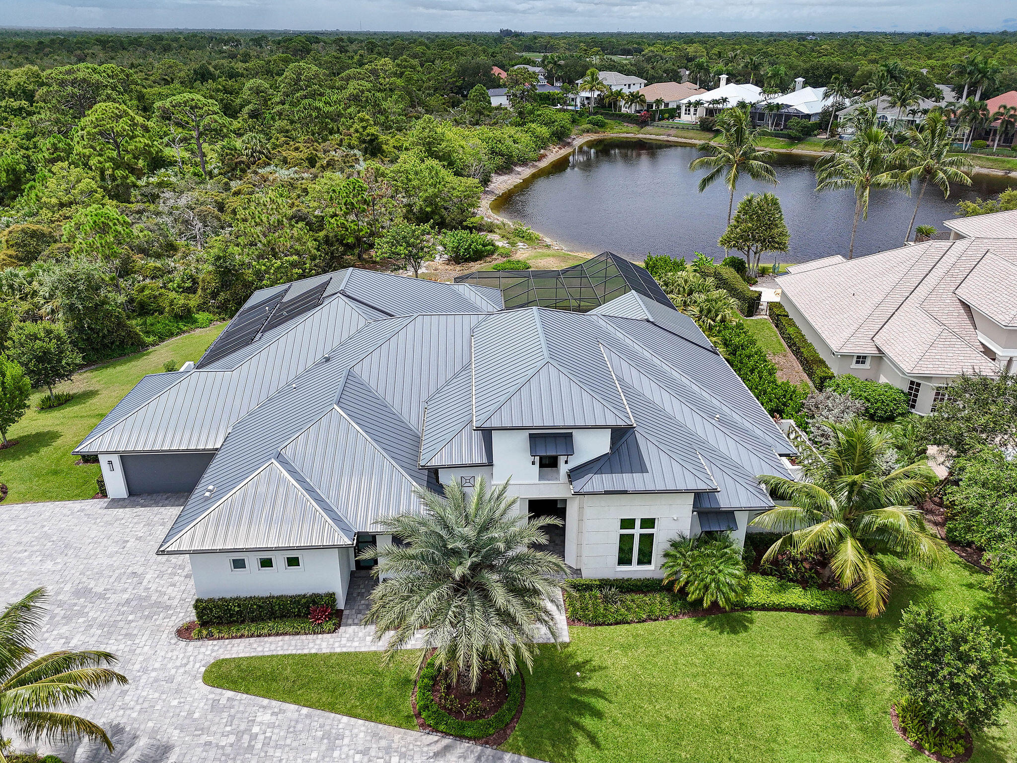 6219 Southeast Moss Ridge Pointe Hobe Sound, FL 33455 - Photo 100 of 108 an aerial view of a house with garden space and sitting area