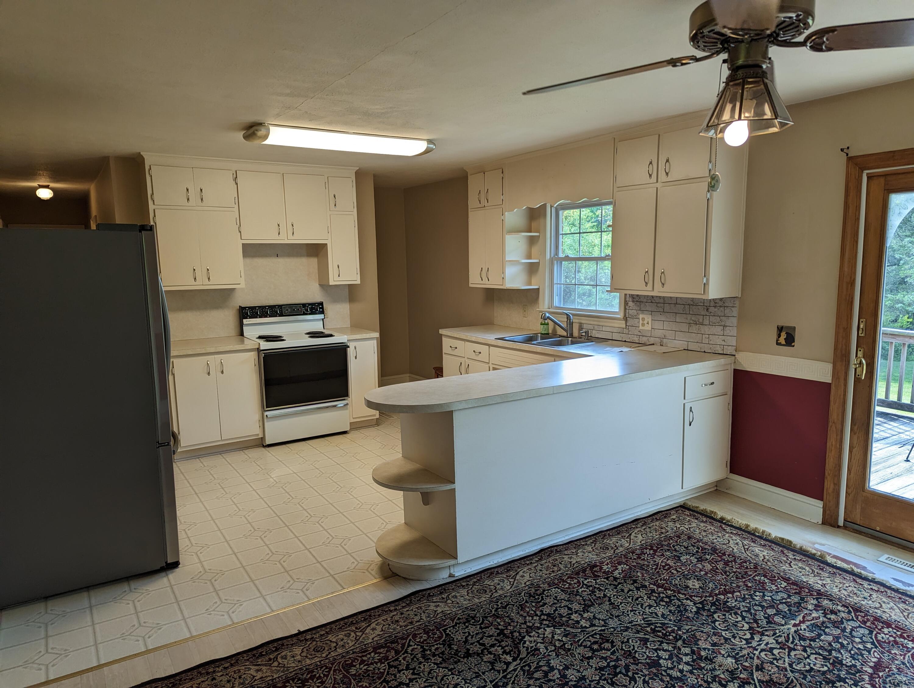7214 6 Mile Post Road Rocky Mount, VA 24151 - Photo 4 of 45 a kitchen with a sink appliances and cabinets