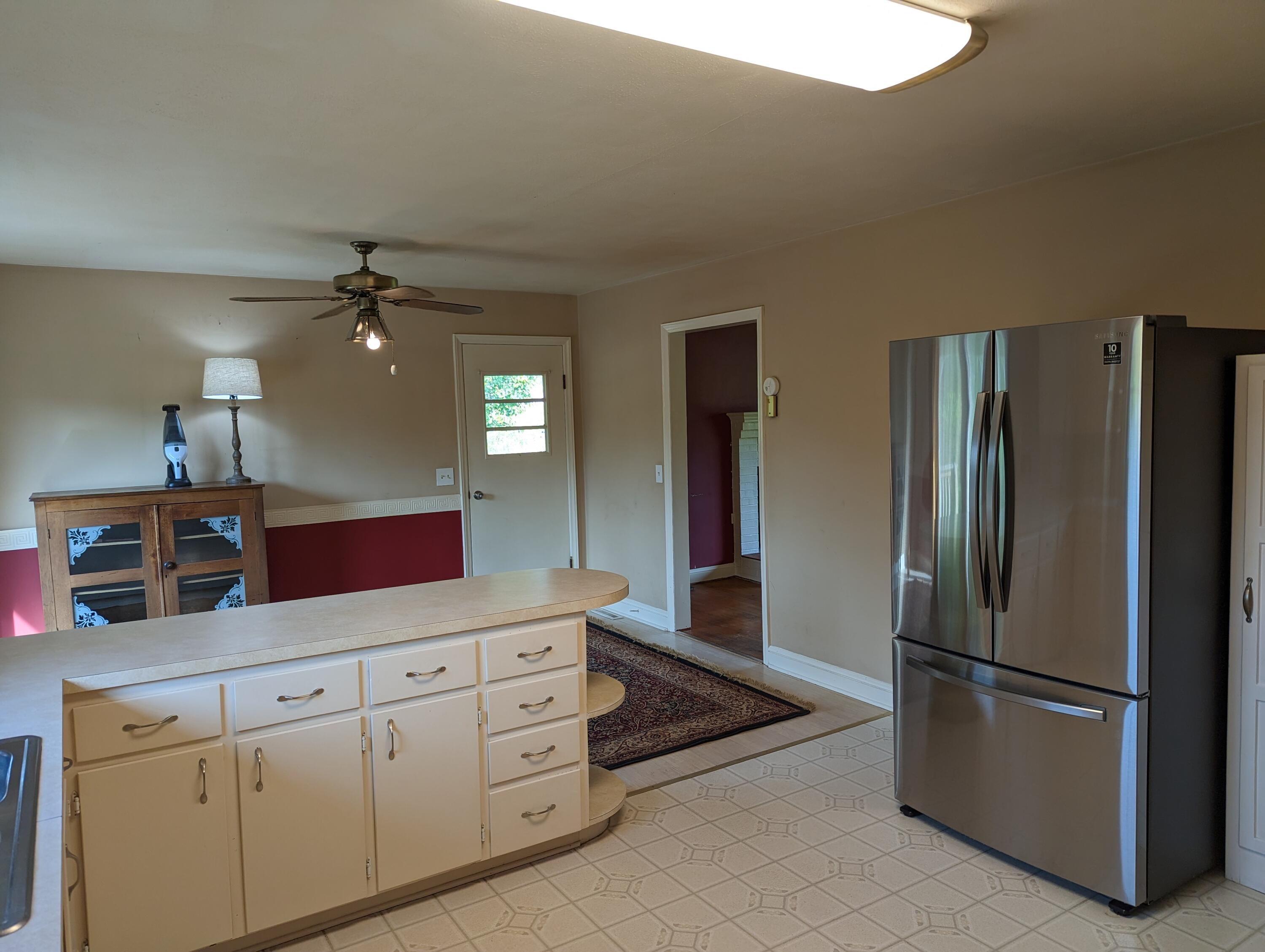 7214 6 Mile Post Road Rocky Mount, VA 24151 - Photo 8 of 45 a kitchen with stainless steel appliances a refrigerator sink and microwave