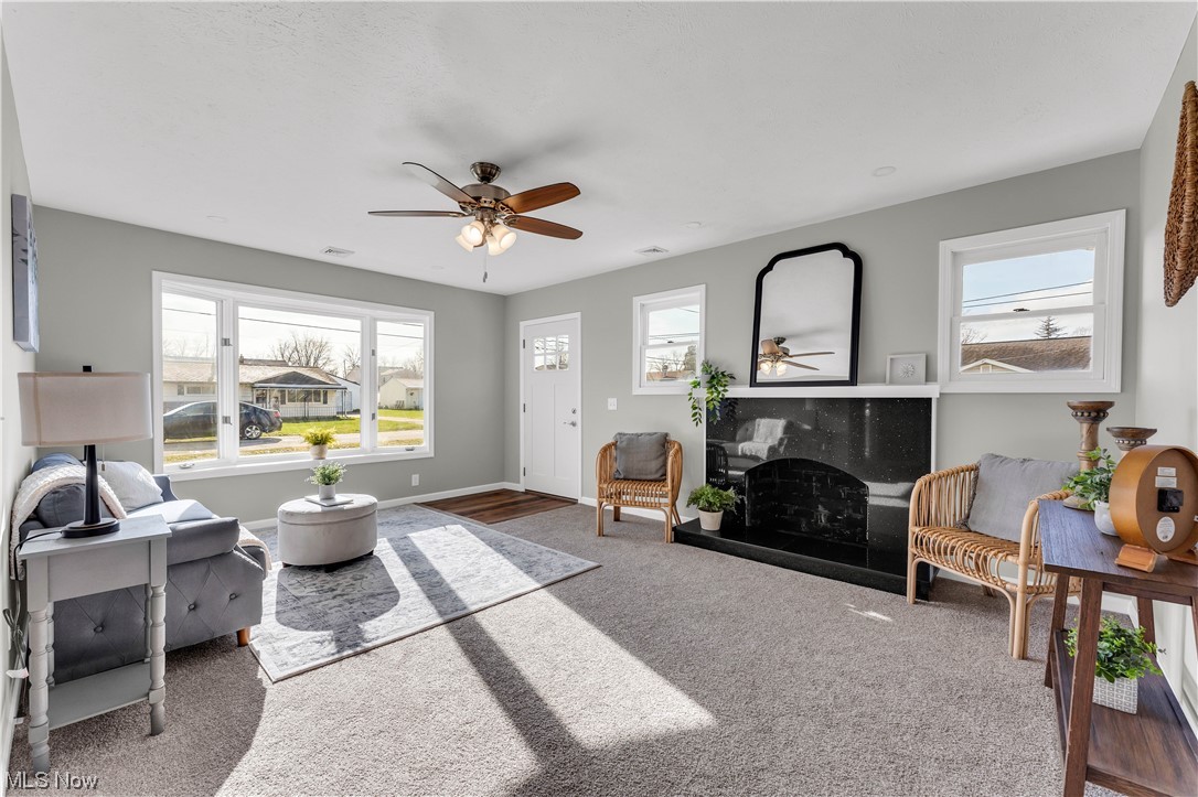 7501 Southland Road Mentor, OH 44060 - Photo 5 of 21 Carpeted living room featuring ceiling fan