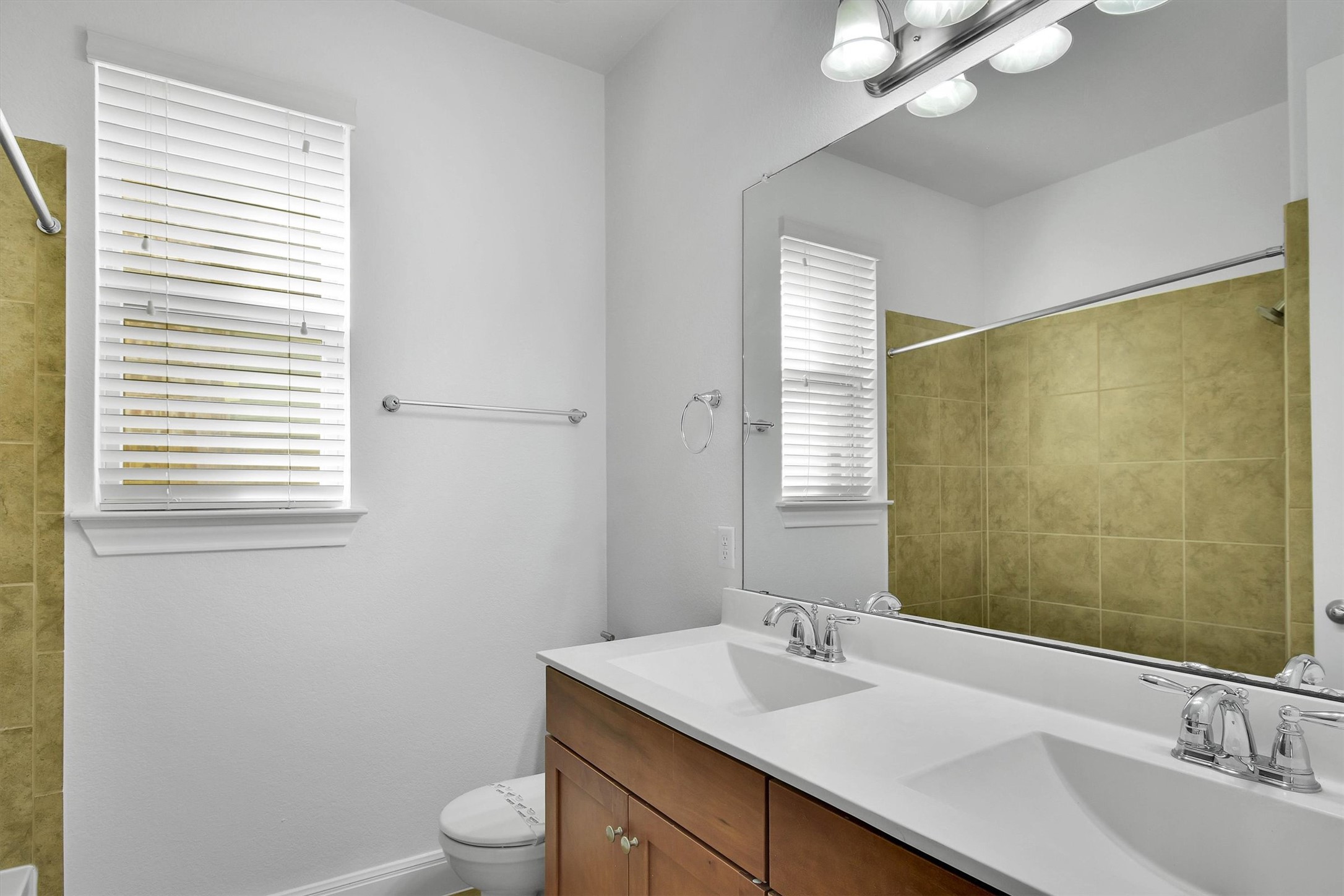 2325 Blended Tree Ranch Drive Leander, TX 78641 - Photo 26 of 35 Double vanity sinks and bright white walls create a refreshed space for daily routines.