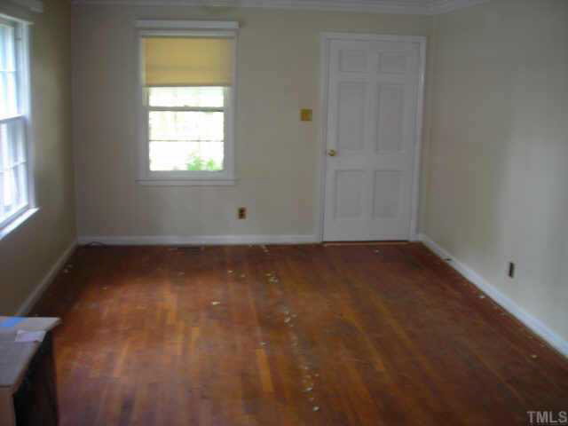 604 Chatham Lane Raleigh, NC 27610 - Photo 4 of 6 an empty room with a window