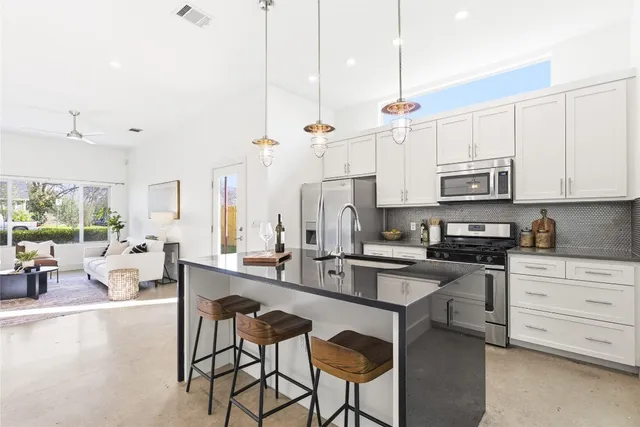 a view of a dining room with furniture and window