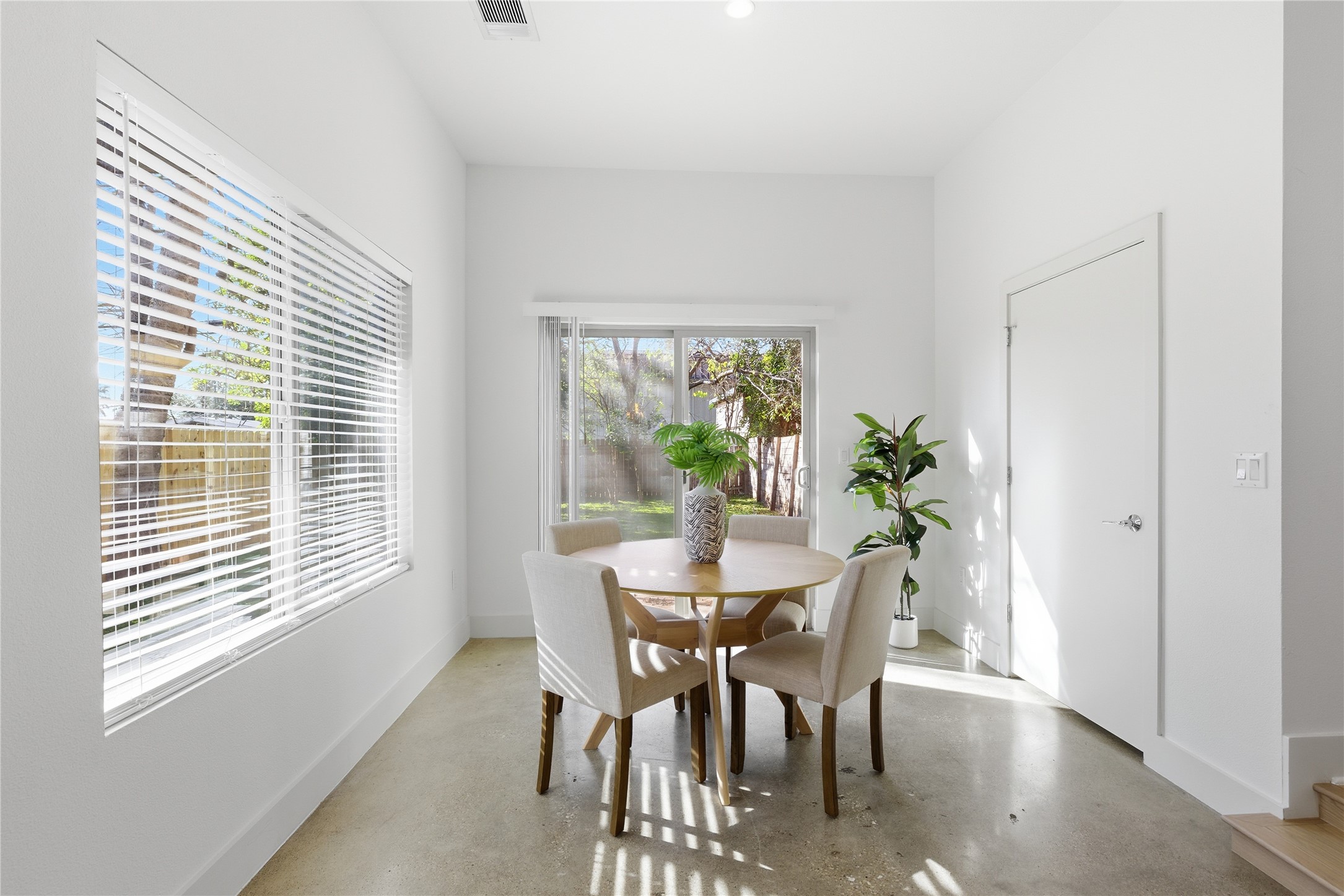 701 Zennia Street, Unit B Austin, TX 78751 - Photo 14 of 40 Dining room with finished concrete flooring
