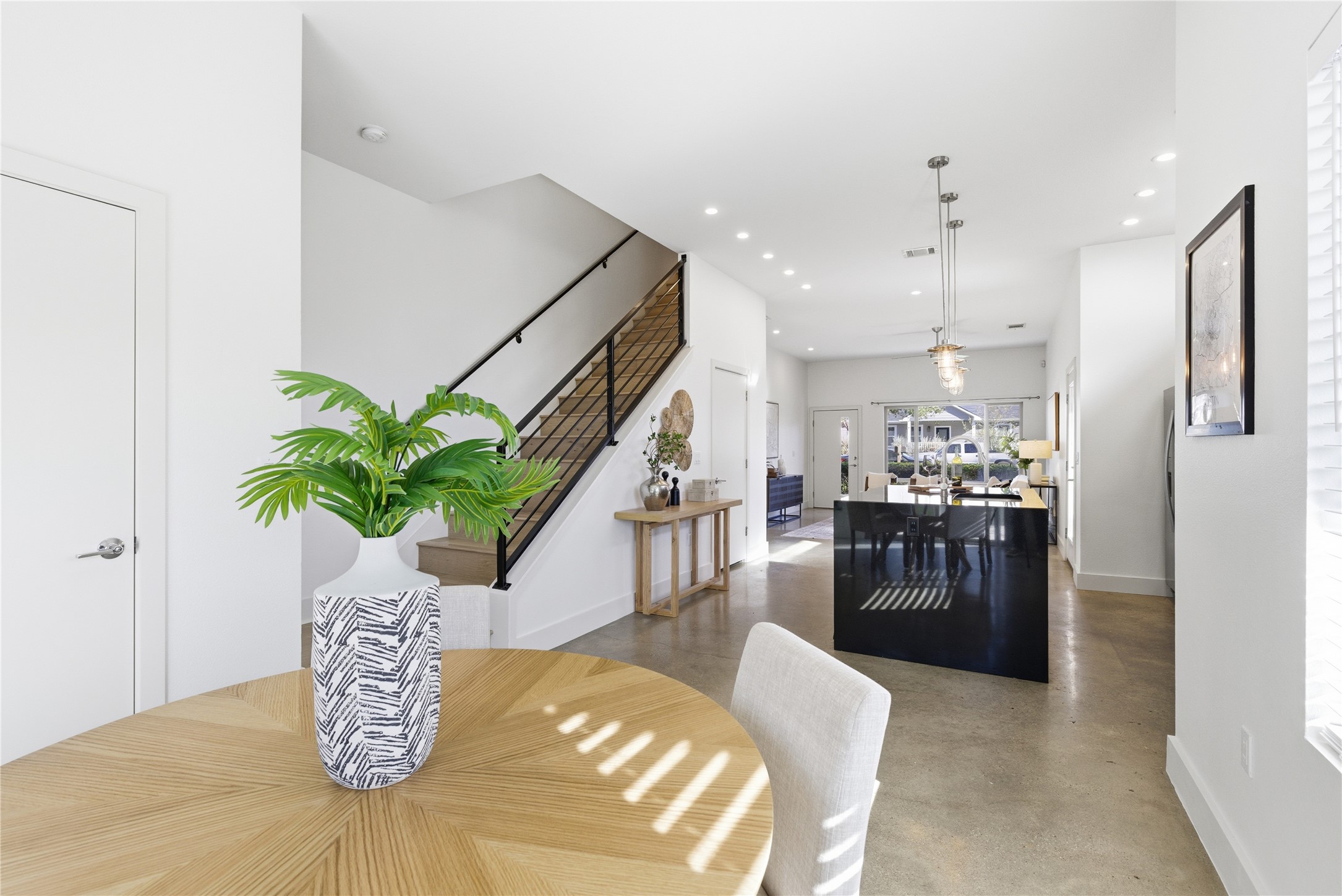 701 Zennia Street, Unit B Austin, TX 78751 - Photo 16 of 40 Dining space featuring stairs, recessed lighting, and concrete floors