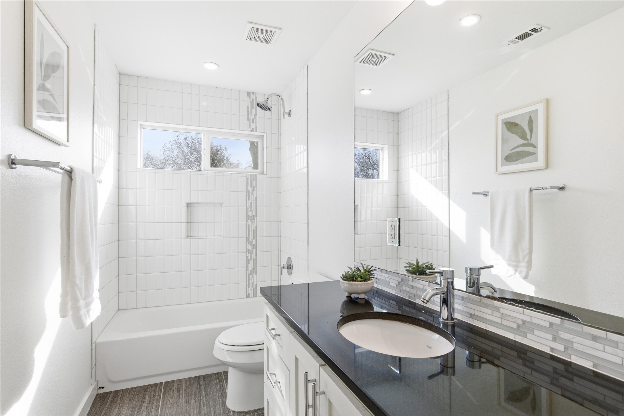 701 Zennia Street, Unit B Austin, TX 78751 - Photo 29 of 40 Full bathroom featuring washtub / shower combination and vanity