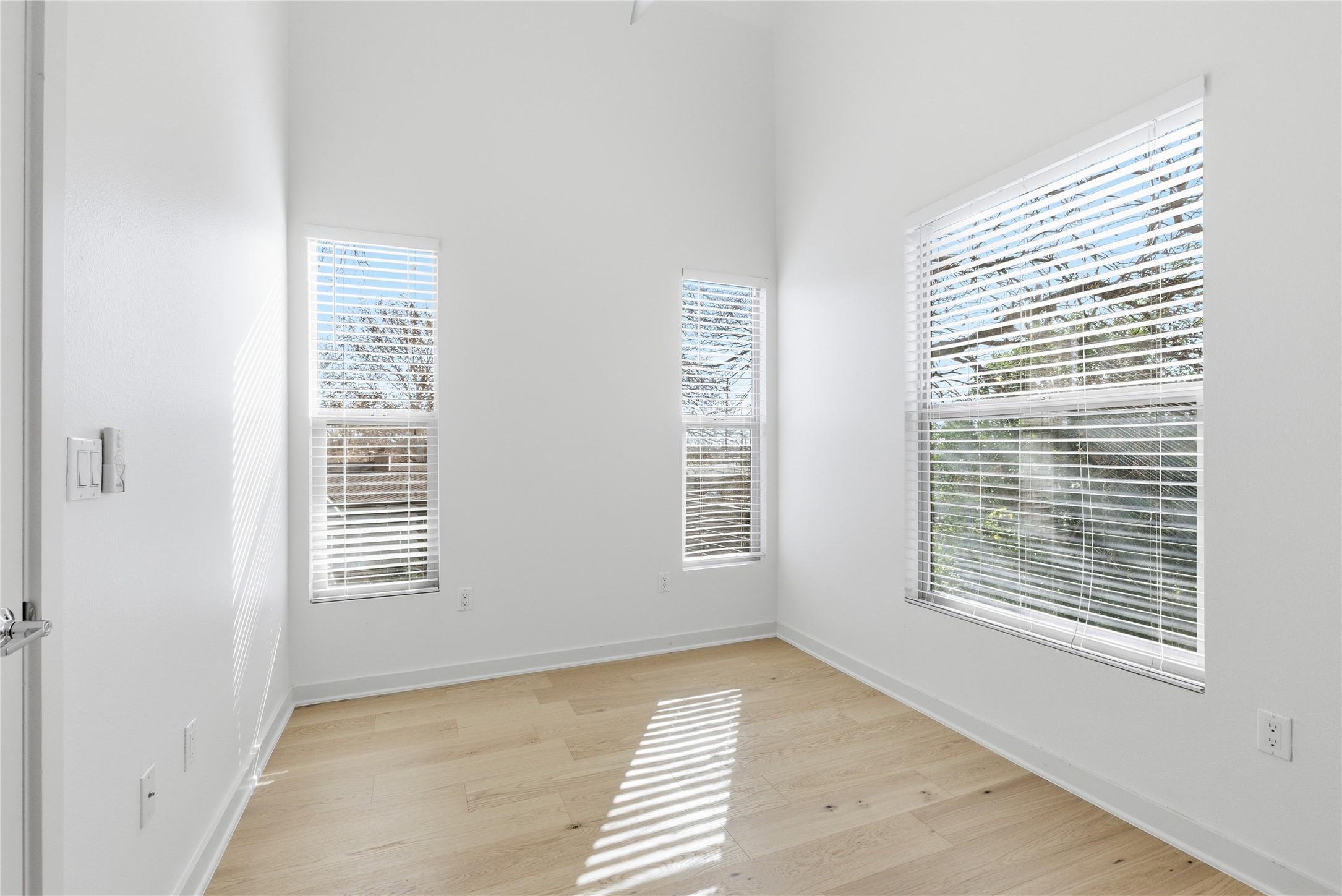 701 Zennia Street, Unit B Austin, TX 78751 - Photo 32 of 40 End bedroom on 2nd floor with really high faulted ceiling and balcony right outside window