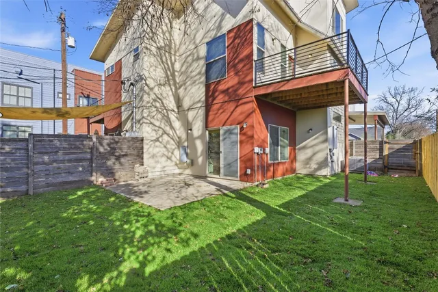 a brick building with a yard in front of it