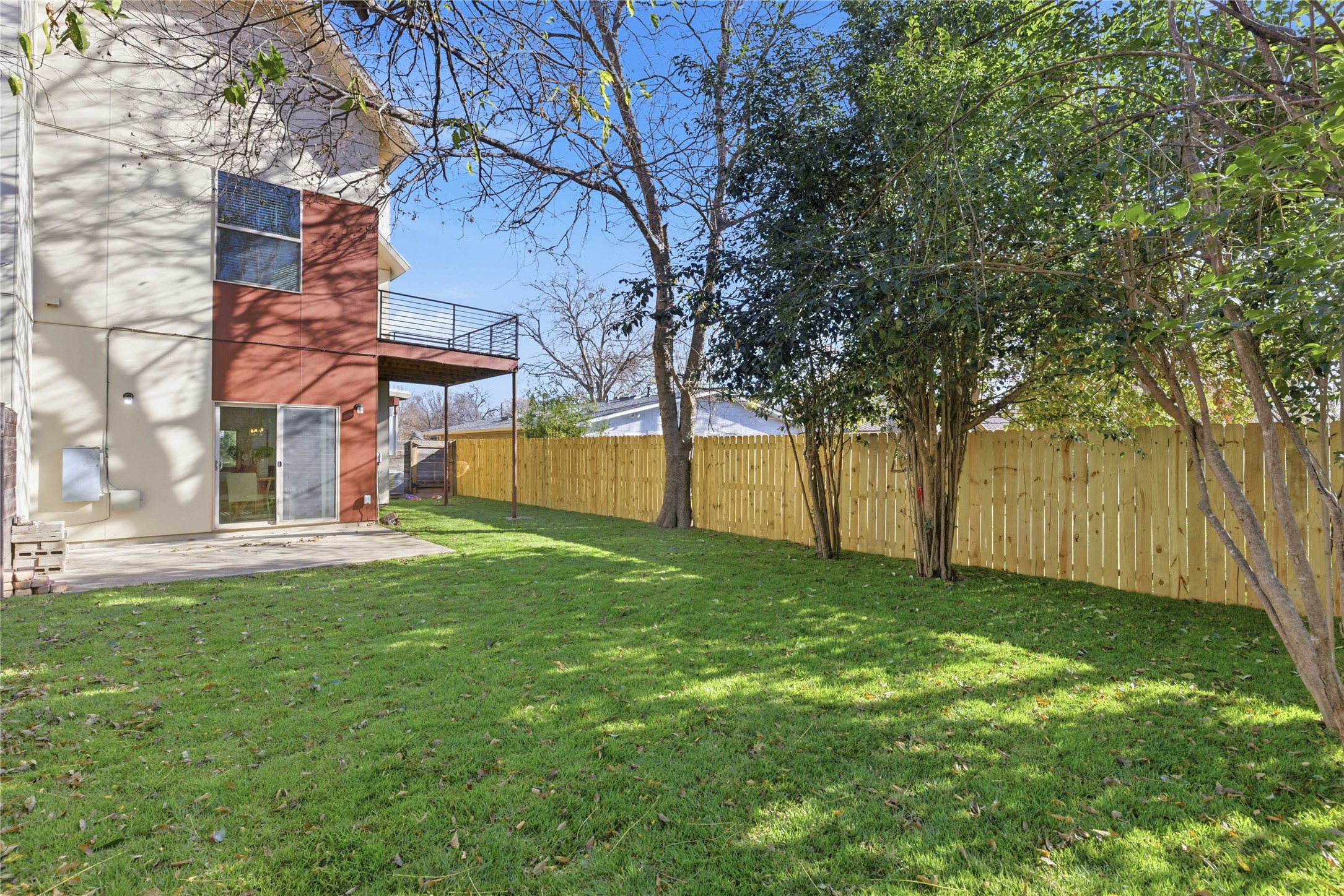 701 Zennia Street, Unit B Austin, TX 78751 - Photo 37 of 40 Fenced backyard with a patio and a balcony