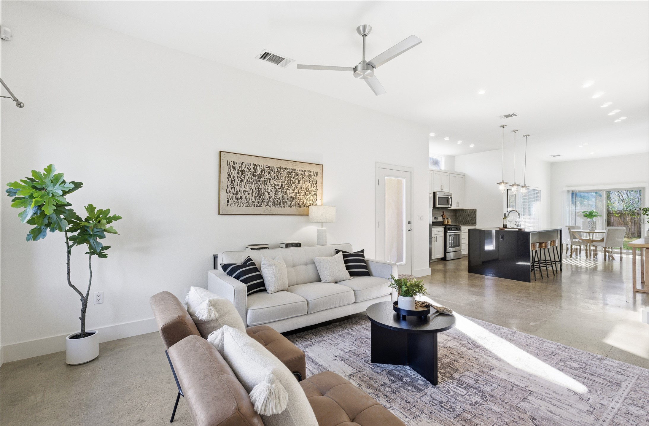 701 Zennia Street, Unit B Austin, TX 78751 - Photo 8 of 40 Living area featuring a ceiling fan and baseboards