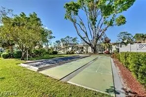 a view of swimming pool with outdoor seating and plants