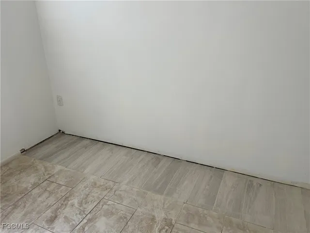 a kitchen with granite countertop cabinets stainless steel appliances and a sink