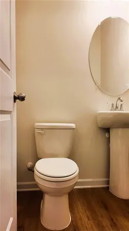 a bathroom with a toilet and a sink