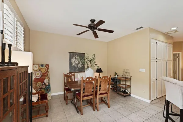 a dining room with furniture and window