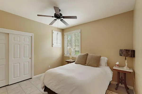 a bedroom with a bed and a table