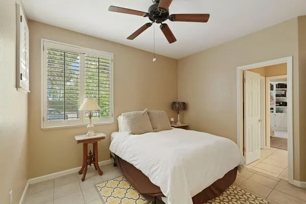 a bedroom with a bed and a table