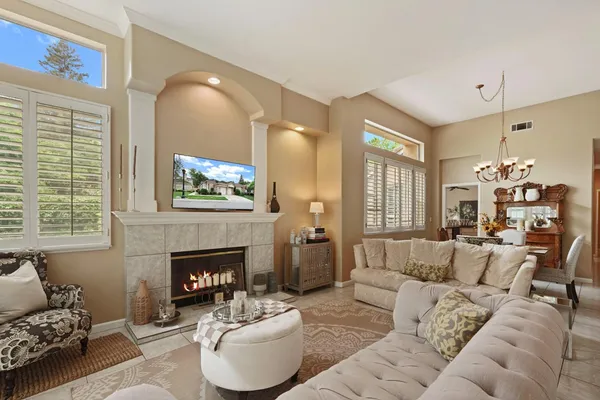 a living room with furniture and a fireplace